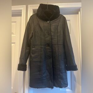 Leather coat with fur-lined interior